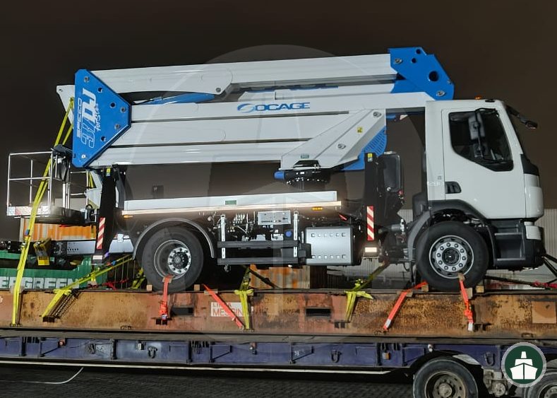 Commercial vehicle prepared for onward shipment during automotive cross stuffing