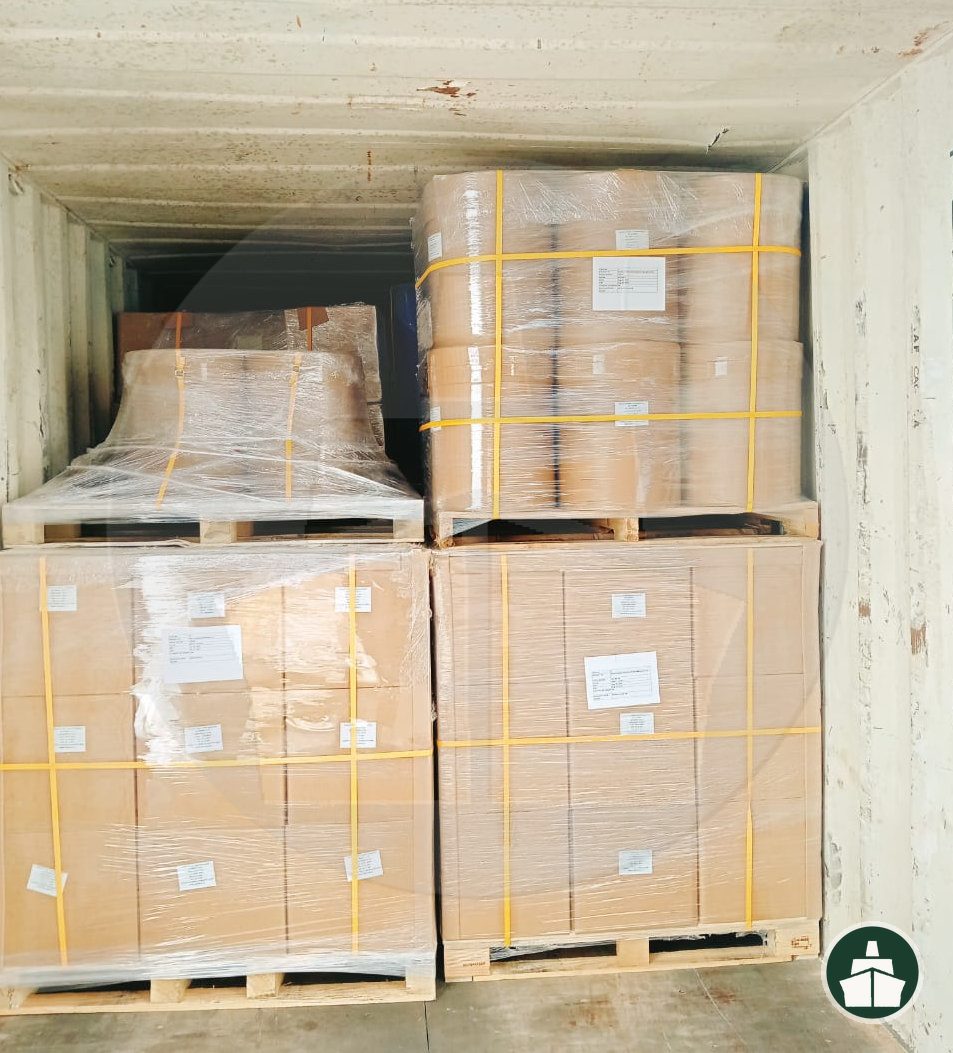 Palletised cartons loaded into a container during cross stuffing at Jebel Ali